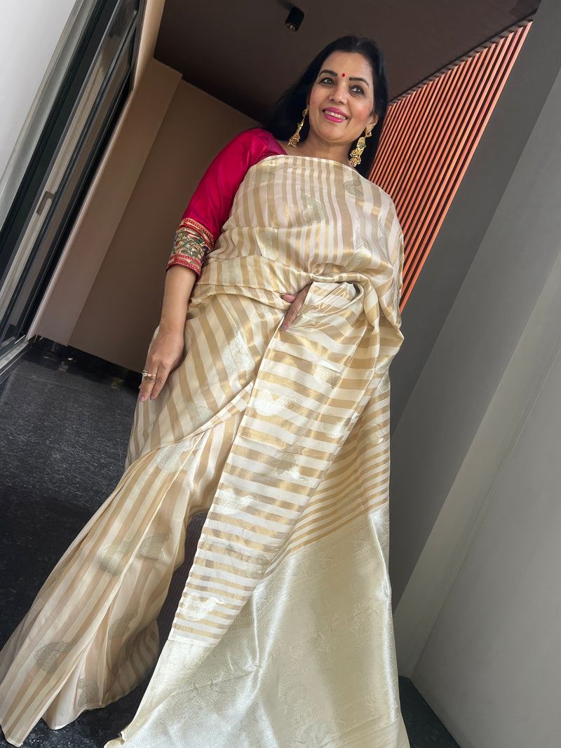 Graceful Beauty of a Cream Ektara Katan Silk Striped Saree with Peacocks