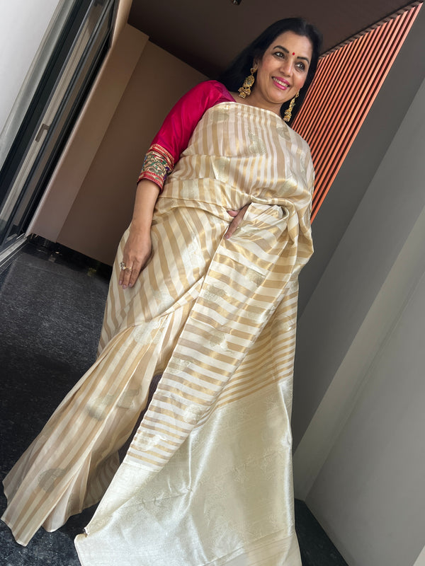 Graceful Beauty of a Cream Ektara Katan Silk Striped Saree with Peacocks